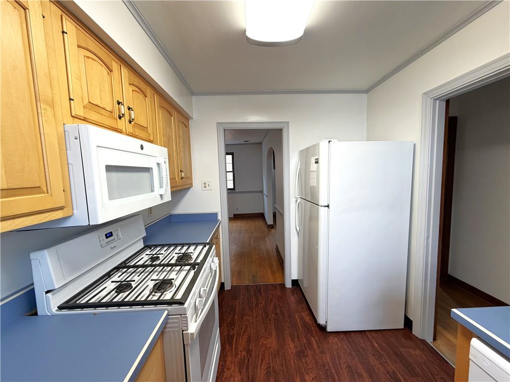 2225 Hampton Street Pittsburgh, PA 15218 - Photo 13 of 36 a kitchen with a refrigerator and a stove top oven