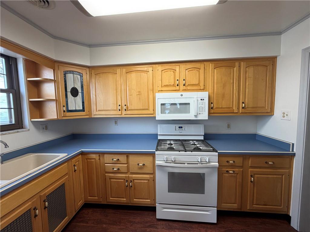 2225 Hampton Street Pittsburgh, PA 15218 - Photo 14 of 36 a kitchen with granite countertop a stove a sink and a cabinets
