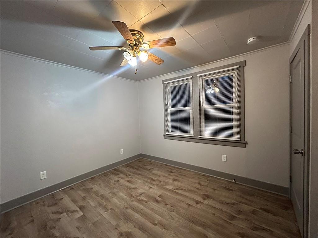 2225 Hampton Street Pittsburgh, PA 15218 - Photo 14 of 20 a view of an empty room with wooden floor and a window