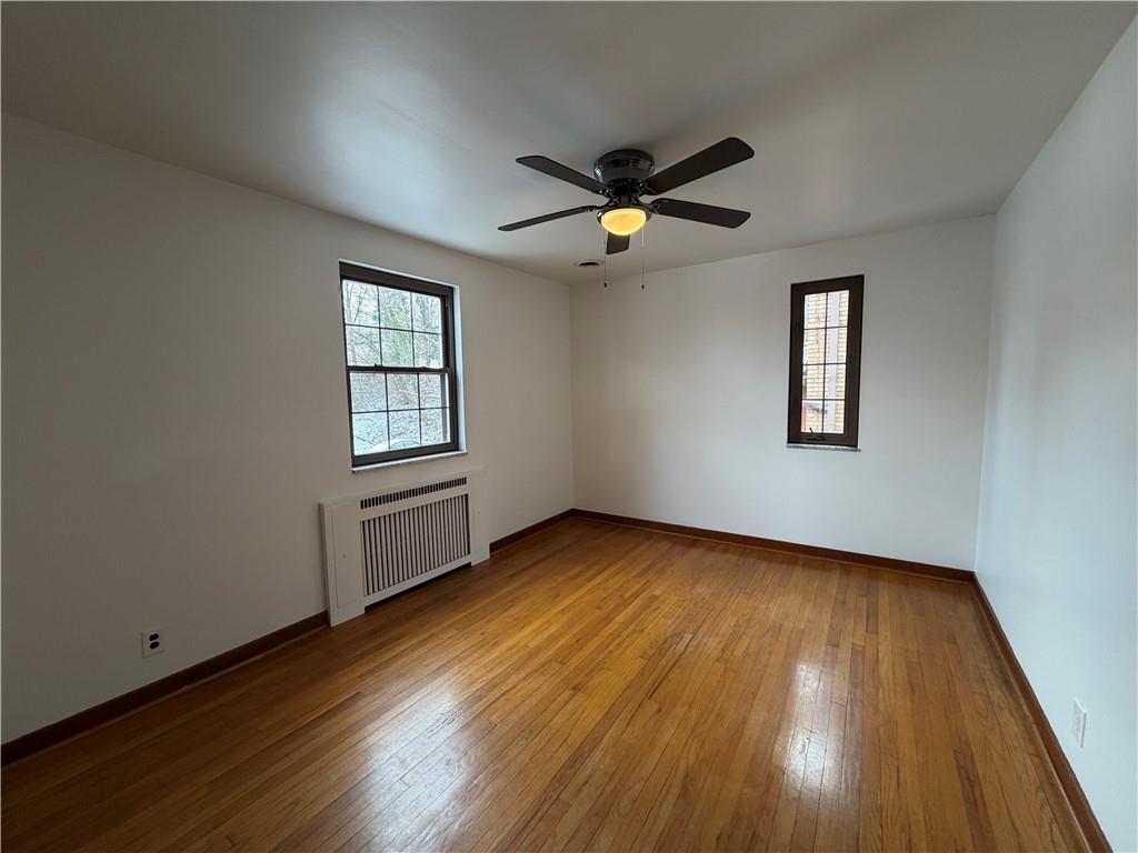 2225 Hampton Street Pittsburgh, PA 15218 - Photo 17 of 36 a view of empty room with wooden floor and fan