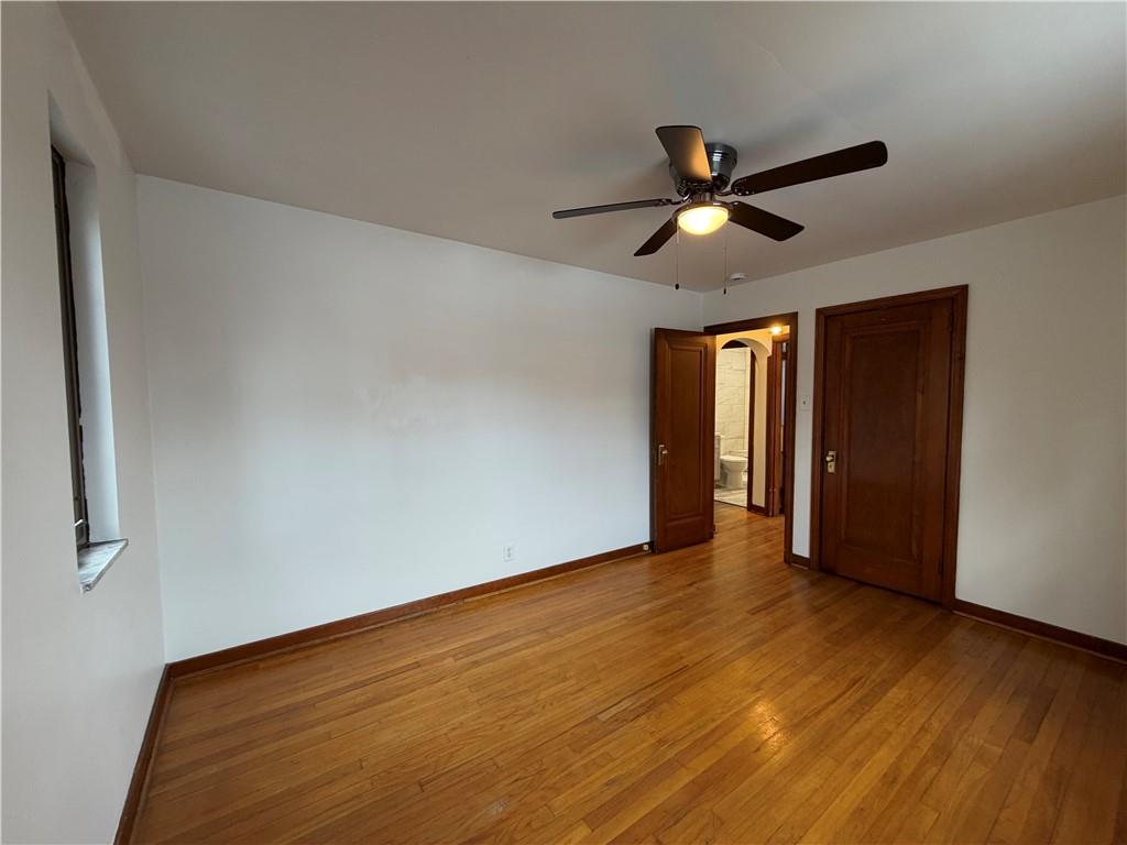 2225 Hampton Street Pittsburgh, PA 15218 - Photo 18 of 36 a view of an empty room and window and wooden floor