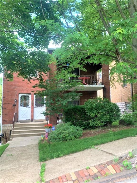 2225 Hampton Street Pittsburgh, PA 15218 - Photo 2 of 20 a front view of a house with a yard