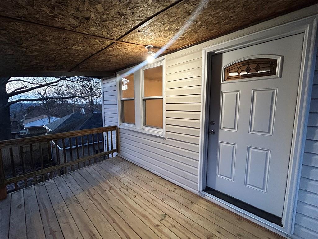 2225 Hampton Street Pittsburgh, PA 15218 - Photo 22 of 36 a view of a balcony with furniture and wooden floor