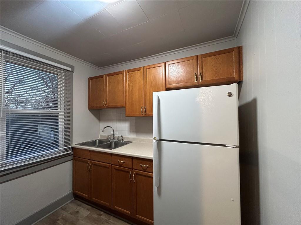 2225 Hampton Street Pittsburgh, PA 15218 - Photo 24 of 36 a kitchen with a refrigerator and a sink