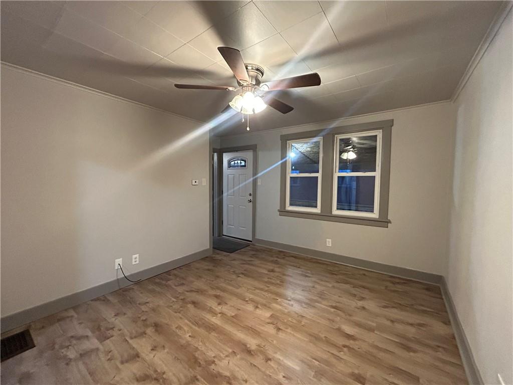 2225 Hampton Street Pittsburgh, PA 15218 - Photo 26 of 36 a view of an empty room with window and chandelier fan