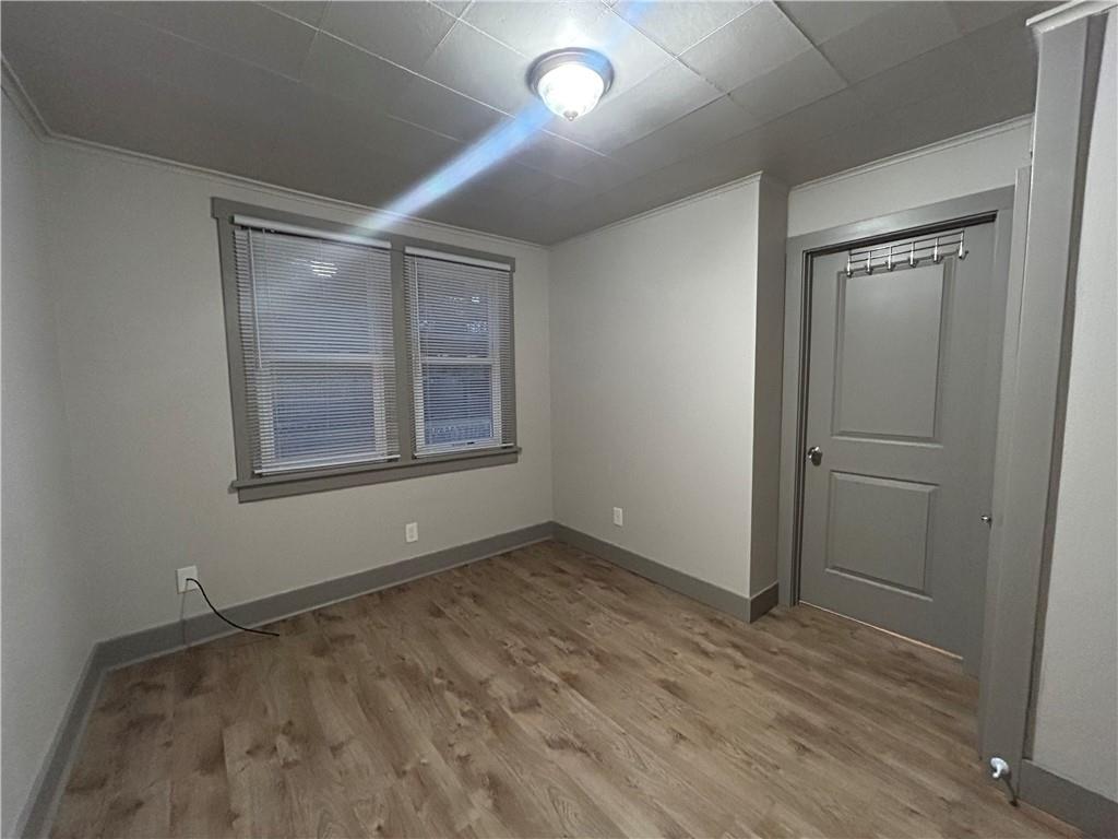 2225 Hampton Street Pittsburgh, PA 15218 - Photo 28 of 36 an empty room with wooden floor and windows