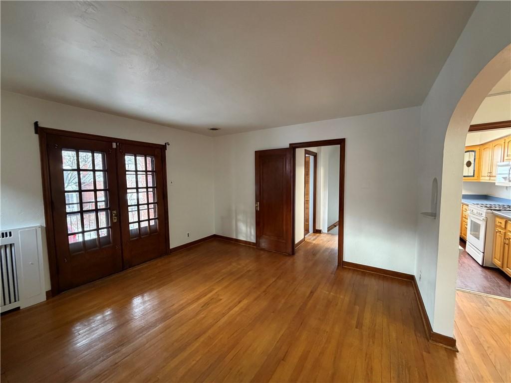 2225 Hampton Street Pittsburgh, PA 15218 - Photo 6 of 36 wooden floor in an empty room with a window