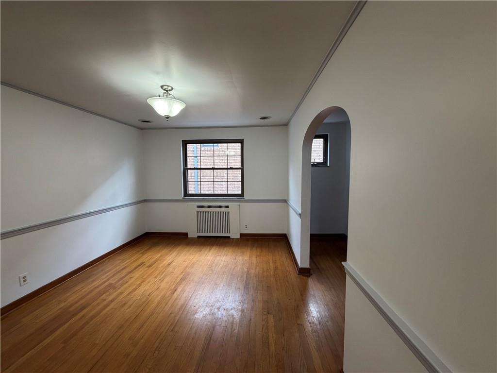 2225 Hampton Street Pittsburgh, PA 15218 - Photo 9 of 36 an empty room with wooden floor and windows