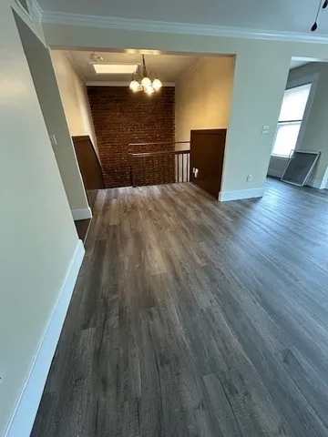 a view of a livingroom with wooden floor