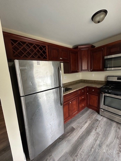 45 Sturbridge Street, Unit 3 Boston, MA 02126 - Photo 6 of 14 a kitchen with a refrigerator sink and stove