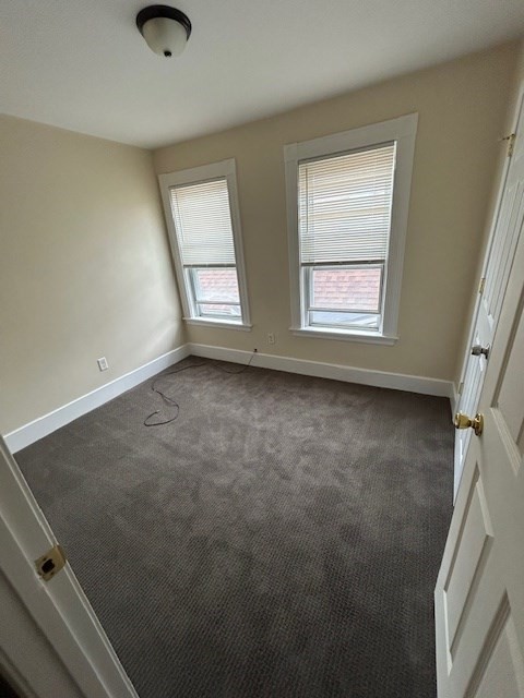 45 Sturbridge Street, Unit 3 Boston, MA 02126 - Photo 9 of 14 an empty room with windows