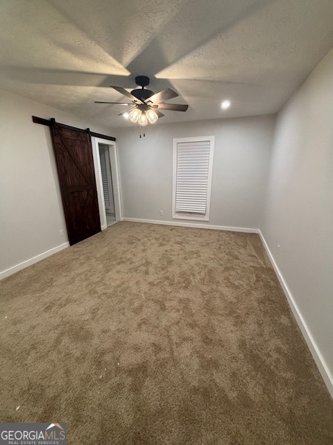 3260 Valley Bend Road South Fulton, GA 30349 - Photo 20 of 23 a view of an empty room with a ceiling fan