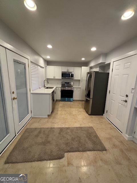 3260 Valley Bend Road South Fulton, GA 30349 - Photo 4 of 23 a view of kitchen with refrigerator and white cabinets