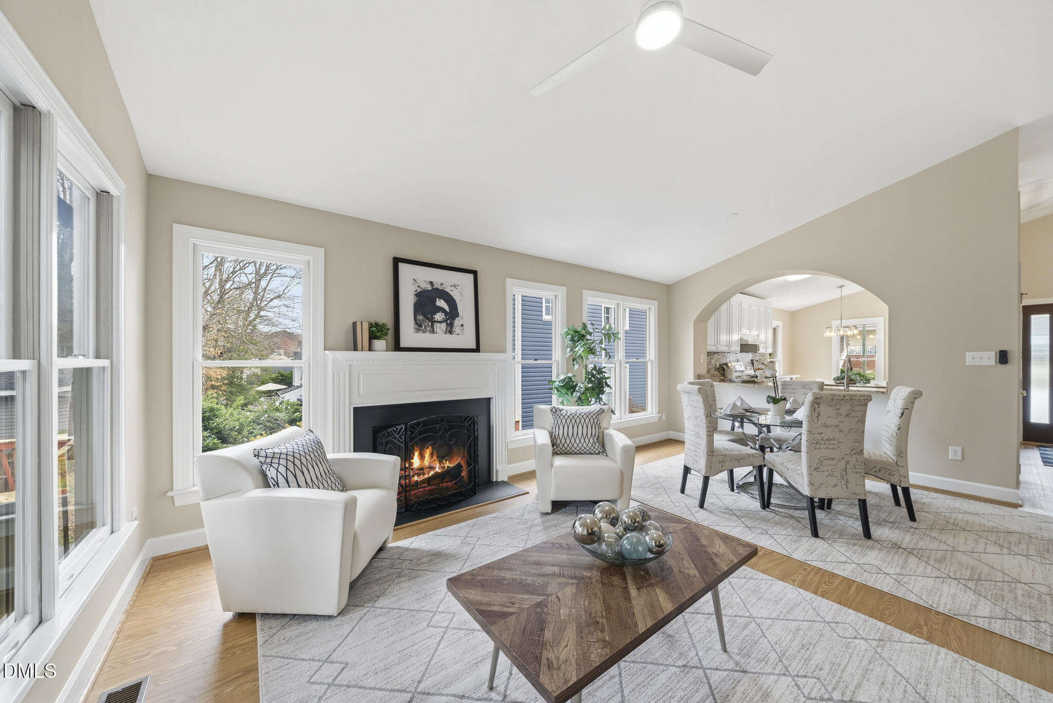 1944 Talamore Court Raleigh, NC 27604 - Photo 14 of 30 a living room with furniture a rug a fireplace and a large window