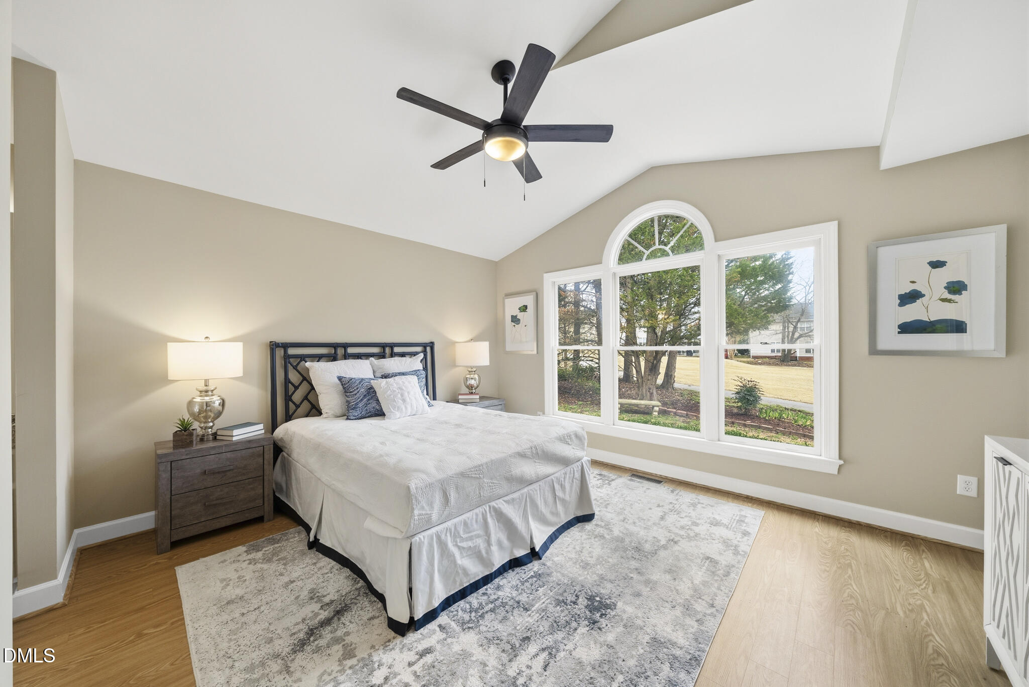 1944 Talamore Court Raleigh, NC 27604 - Photo 15 of 30 a bedroom with a large bed and a large window