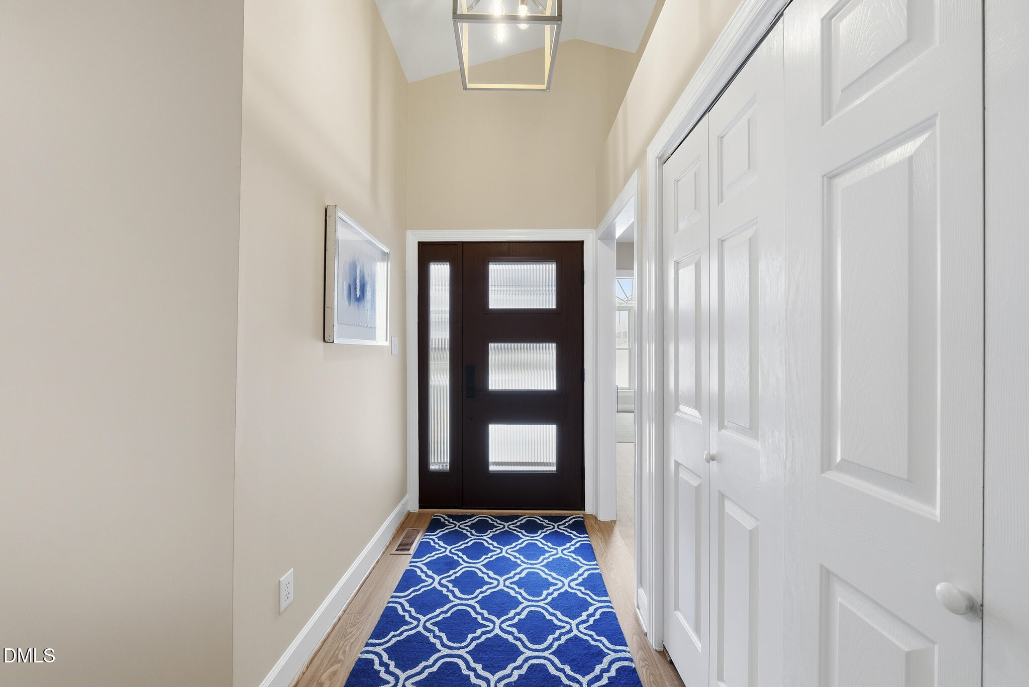 1944 Talamore Court Raleigh, NC 27604 - Photo 3 of 30 a view of a hallway with wooden floor and windows