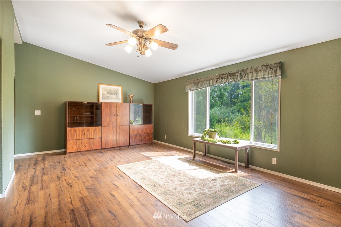 1735 Kaas Road Ferndale, WA 98248 - Photo 14 of 37 a living room with a couch and a table