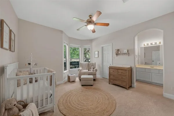 a bedroom with bed and window
