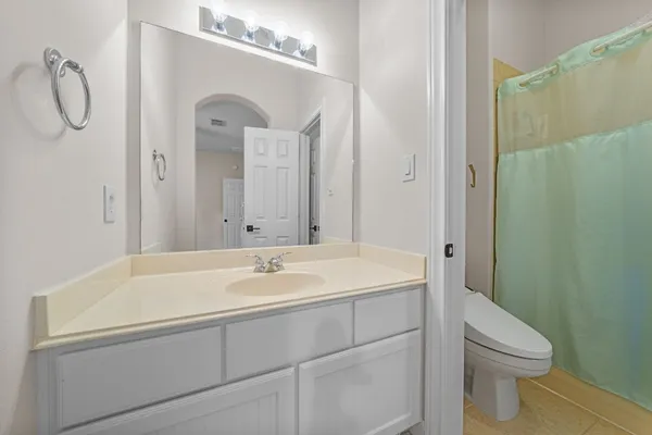 a view of a room that has a table and chair in it