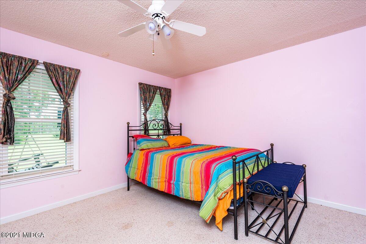 2696 Lower Hartley Bridge Road Byron, GA 31008 - Photo 11 of 24 a bedroom with a bed and a chandelier