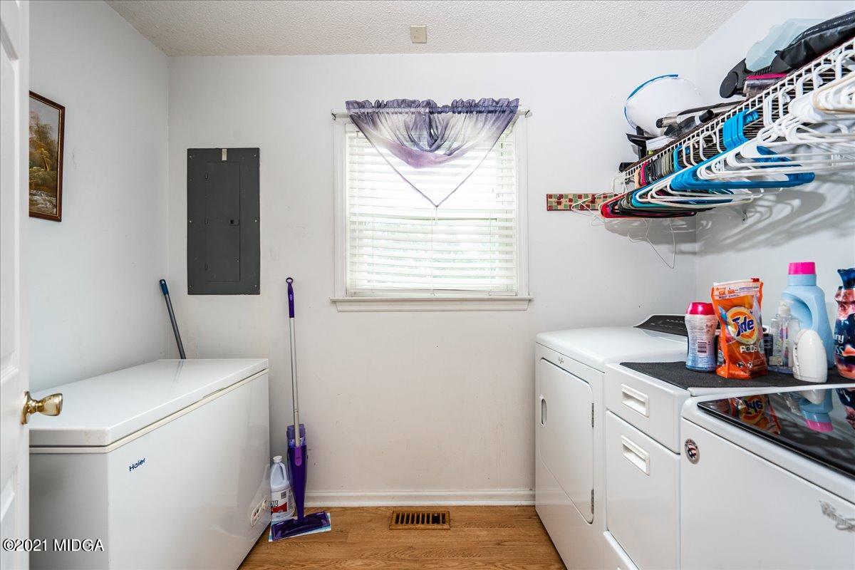 2696 Lower Hartley Bridge Road Byron, GA 31008 - Photo 23 of 24 a room with storage and utility