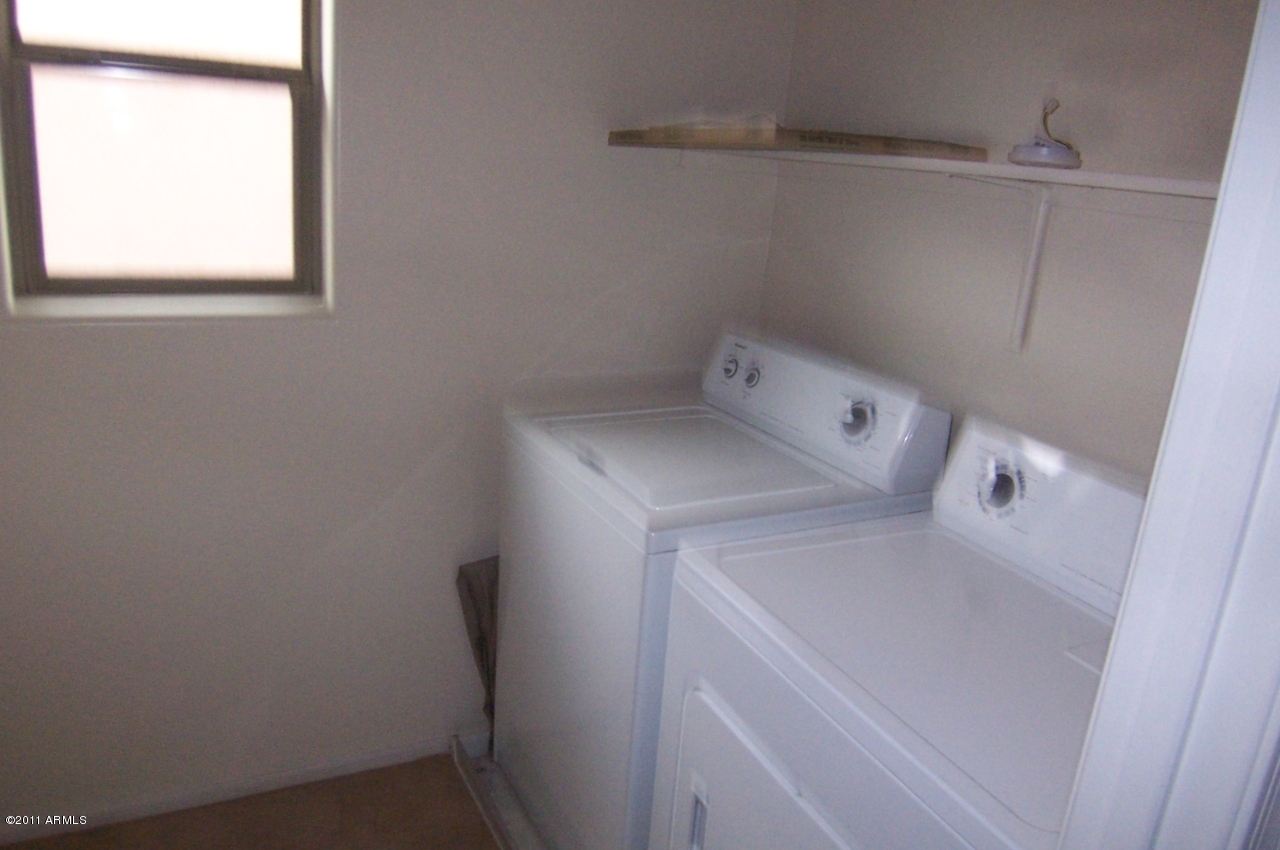 94 East Catclaw Street Gilbert, AZ 85296 - Photo 7 of 11 Laundry Room Inside