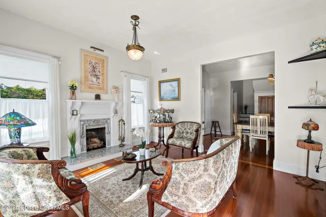 a kitchen with granite countertop a stove a sink and a microwave