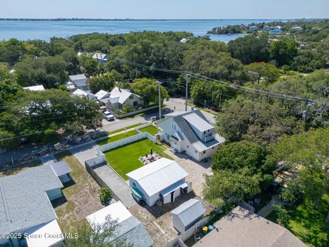 an aerial view of a house with a garden