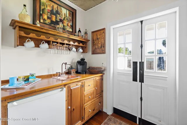 a bedroom with a bed and a mirror