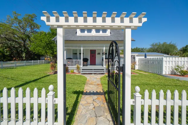 a view of a chair and tables in the balcony