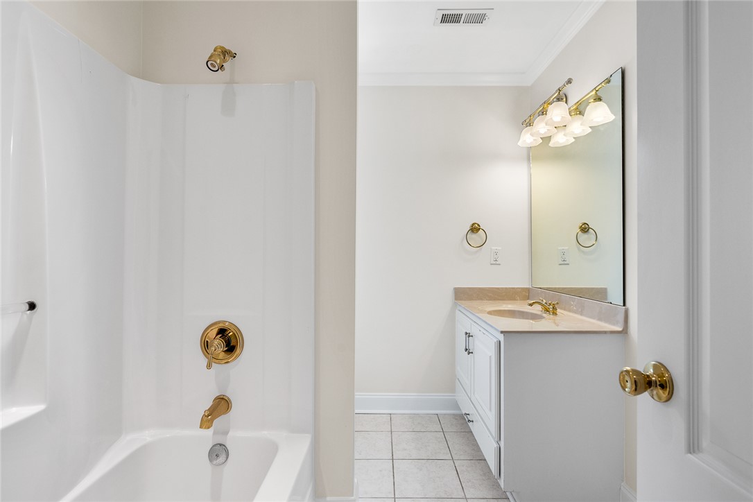 135 Sunset Bay Boulevard Seneca, SC 29672 - Photo 38 of 50 A pristine bath featuring a classic vanity, ample mirror, and gleaming fixtures.