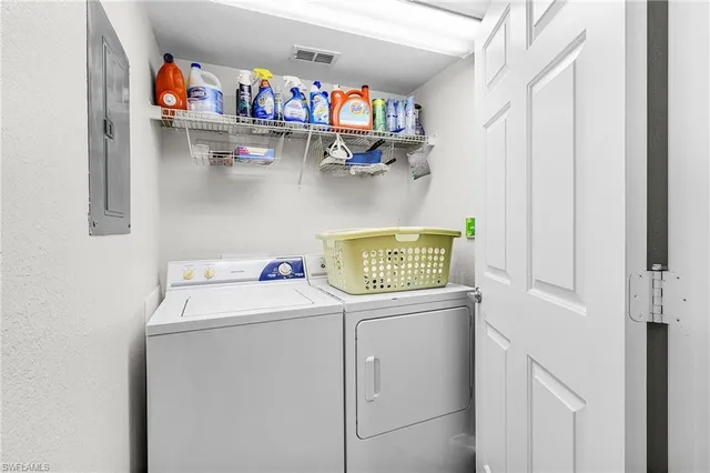 an aerial view of residential houses with outdoor space and swimming pool