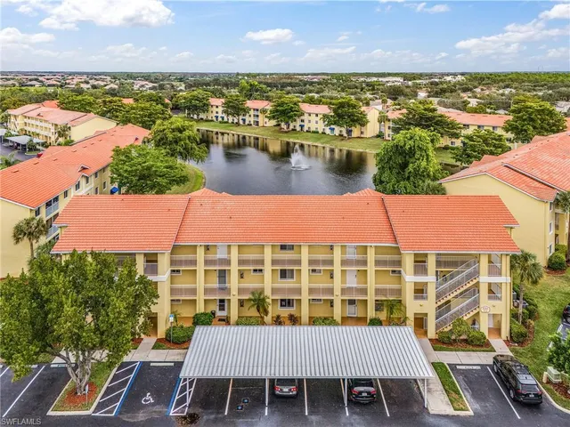 an aerial view of a city with ocean view