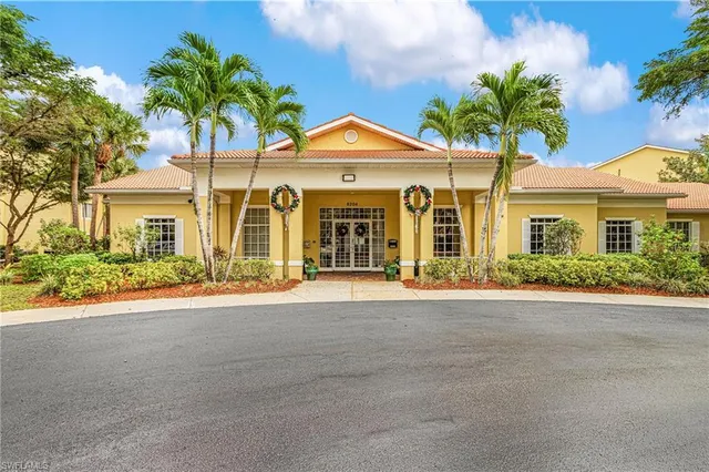 a swimming pool with outdoor seating and yard