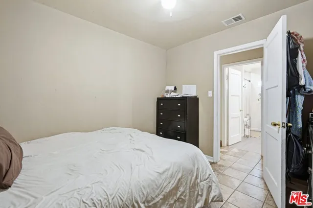 a bathroom with a toilet a sink and a mirror