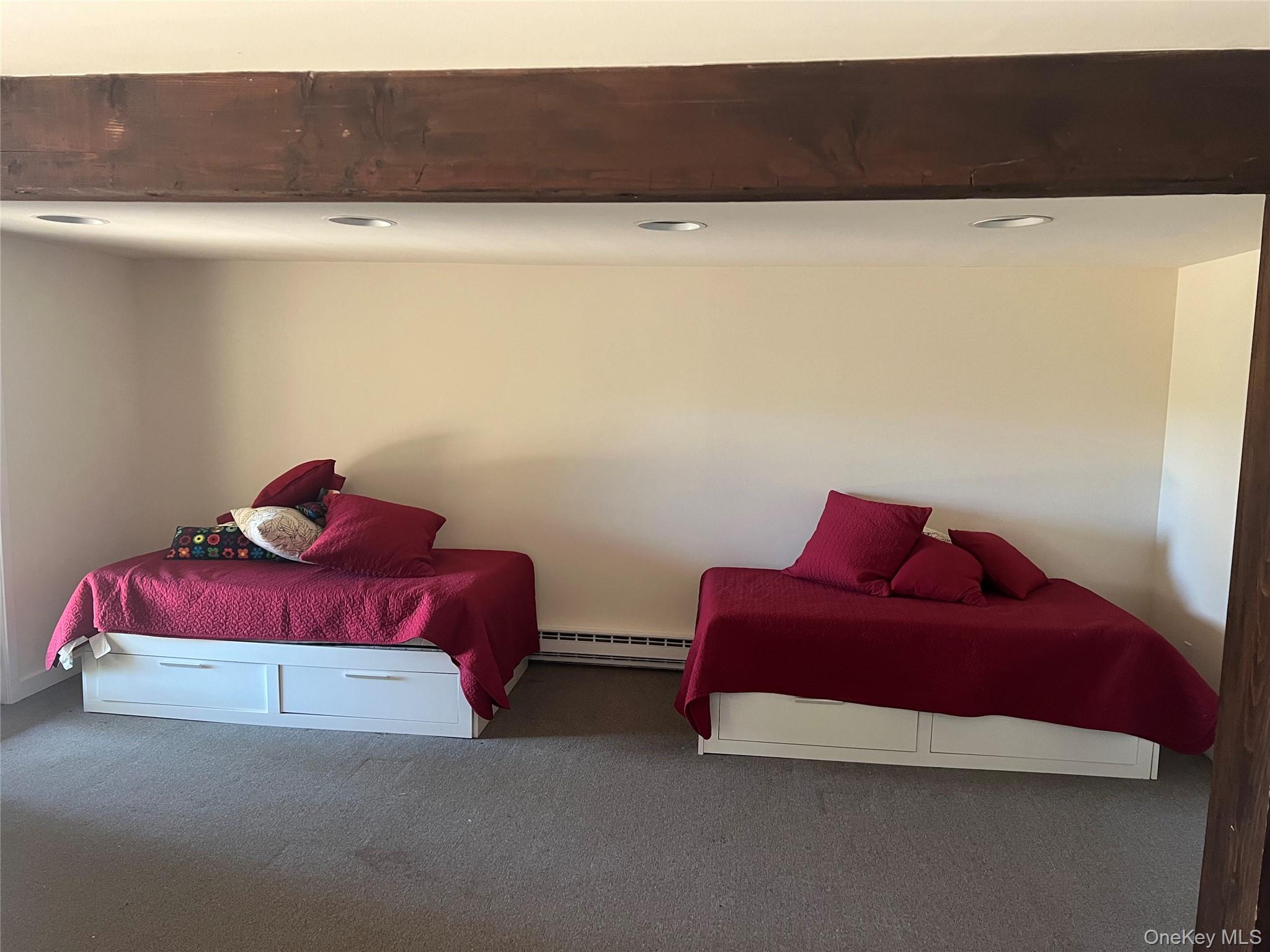 76 Whippoorwill Pond Road, Unit 78 Garrison, NY 10524 - Photo 14 of 24 a bedroom with a bed and a couch