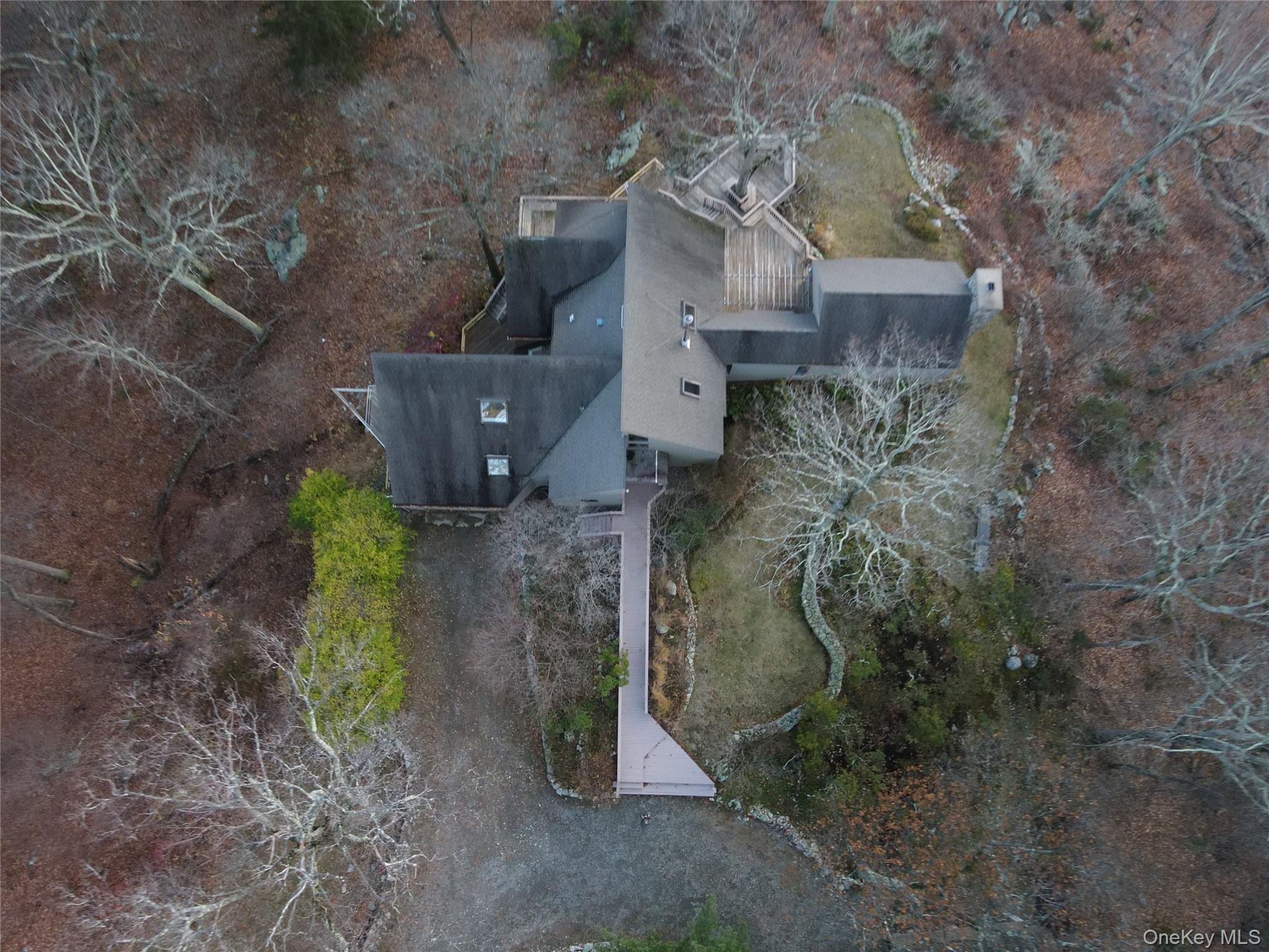76 Whippoorwill Pond Road, Unit 78 Garrison, NY 10524 - Photo 16 of 24 a aerial view of a house with yard