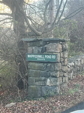 a view of a wooden door and trees
