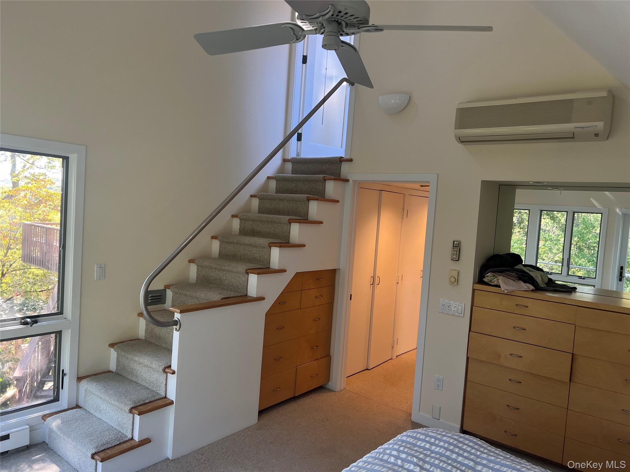76 Whippoorwill Pond Road, Unit 78 Garrison, NY 10524 - Photo 9 of 24 a view of entryway and bedroom with wooden floor