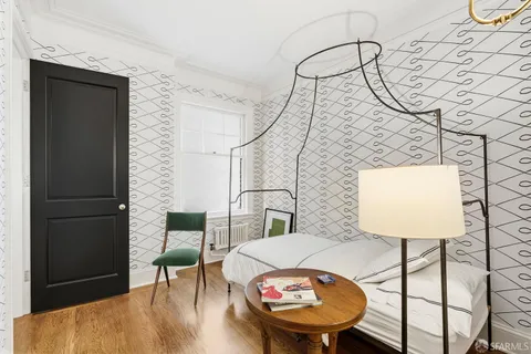 a balcony with table and chairs