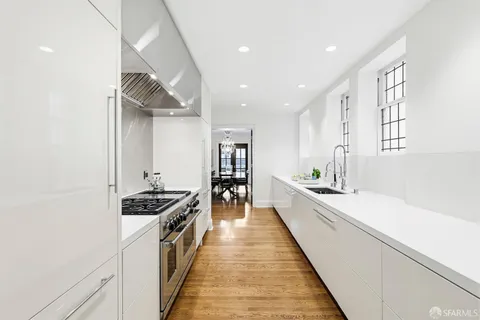 a large kitchen with stainless steel appliances