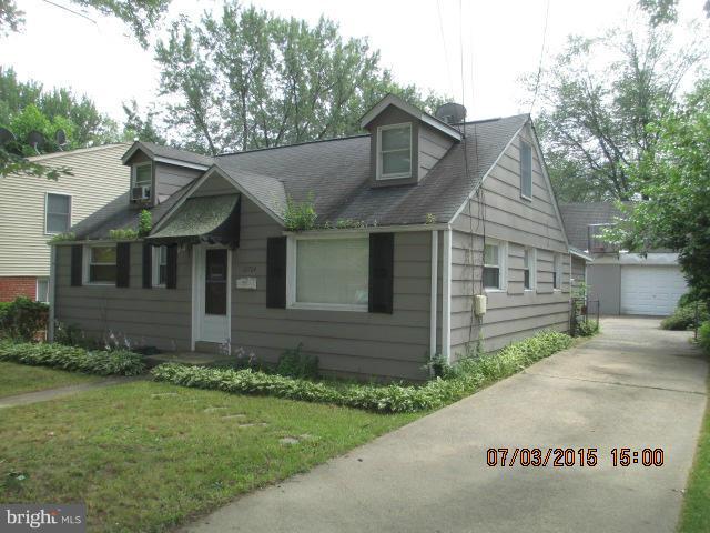 12704 Flack Street Silver Spring, MD 20906 - Photo 1 of 14 a front view of a house with a garden