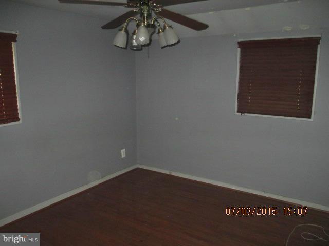 12704 Flack Street Silver Spring, MD 20906 - Photo 11 of 14 a view of small space with wooden floor and windows