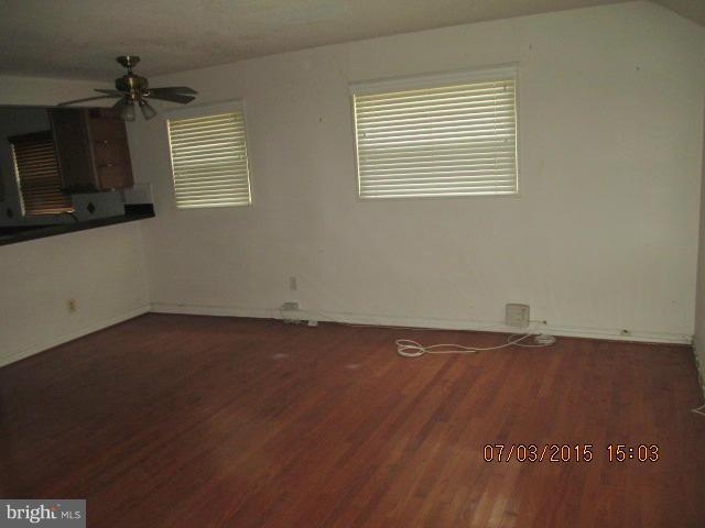 12704 Flack Street Silver Spring, MD 20906 - Photo 3 of 14 an empty room with a window