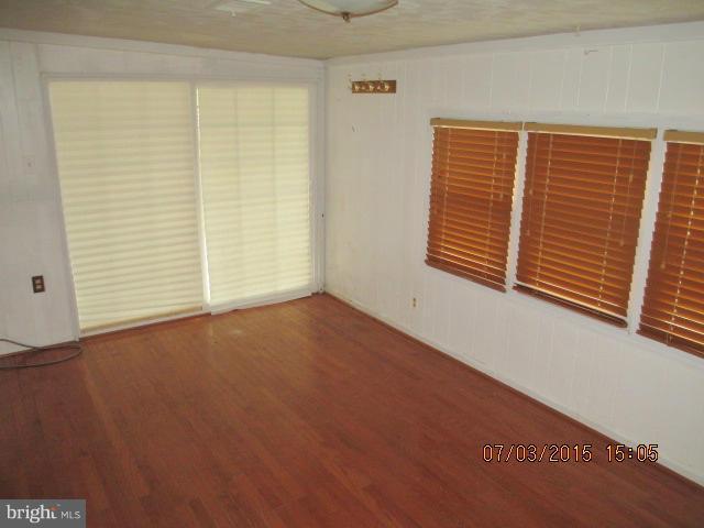 12704 Flack Street Silver Spring, MD 20906 - Photo 7 of 14 an empty room with windows