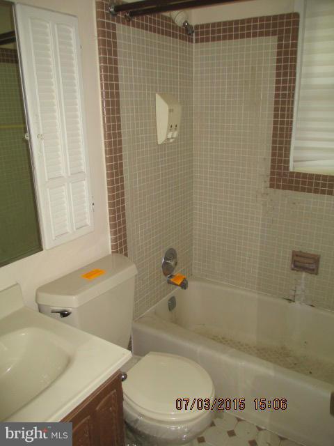 12704 Flack Street Silver Spring, MD 20906 - Photo 9 of 14 a bathroom with a sink and a bathtub