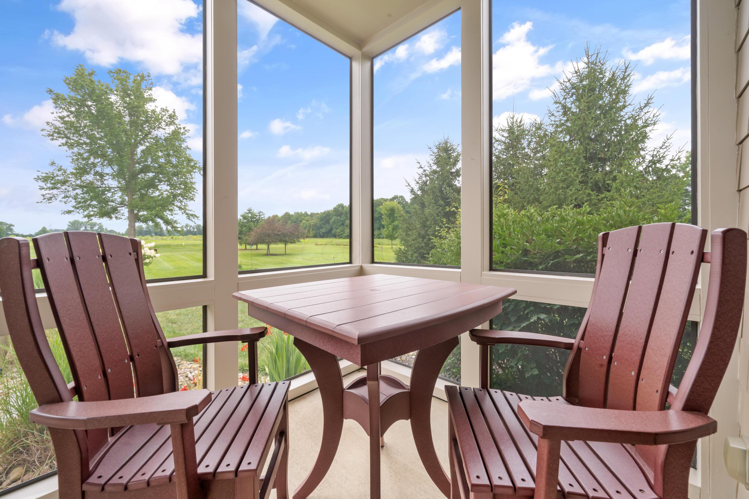 4640 Maynard Road Delaware, OH 43015 - Photo 86 of 91 Enclosed screened porch featuring expansive windows, a neutral floor, and exterior siding