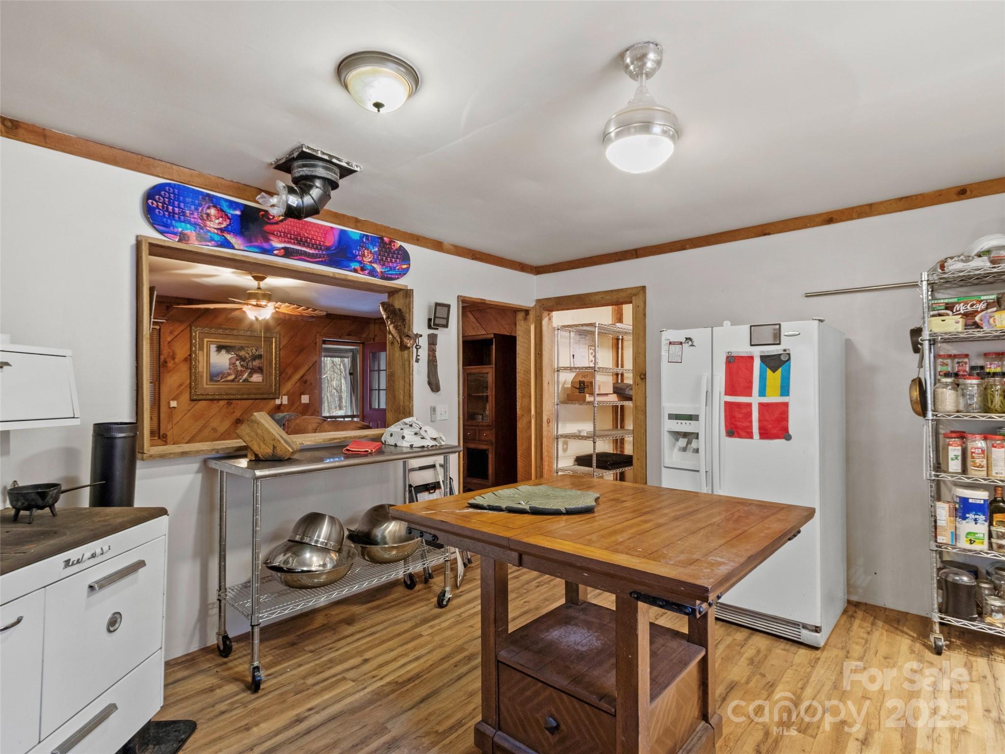 1571 Roaring Fork Road Burnsville, NC 28714 - Photo 19 of 37 a view of a dining room with furniture window and wooden floor