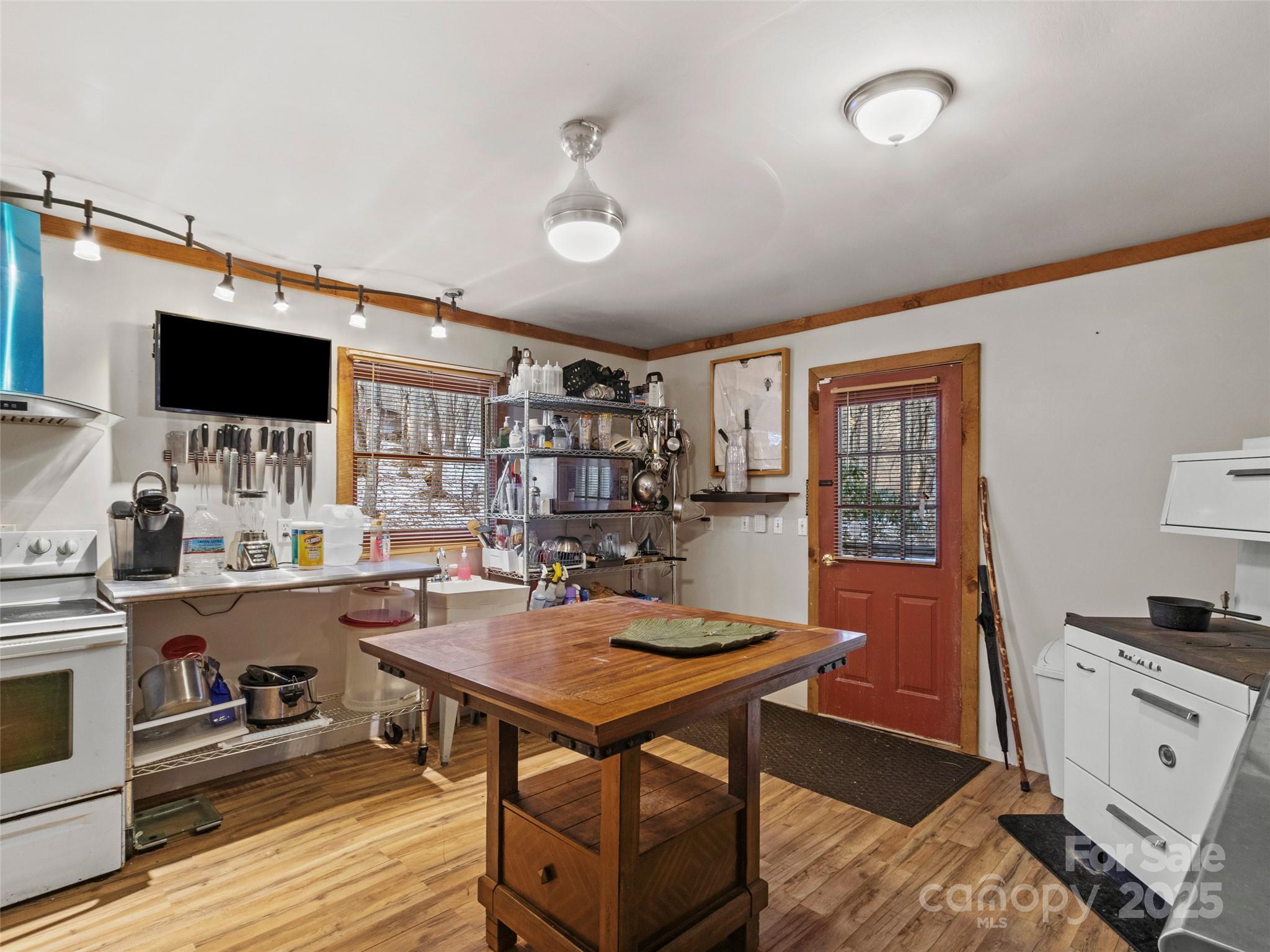 1571 Roaring Fork Road Burnsville, NC 28714 - Photo 21 of 37 a view of a workspace with furniture