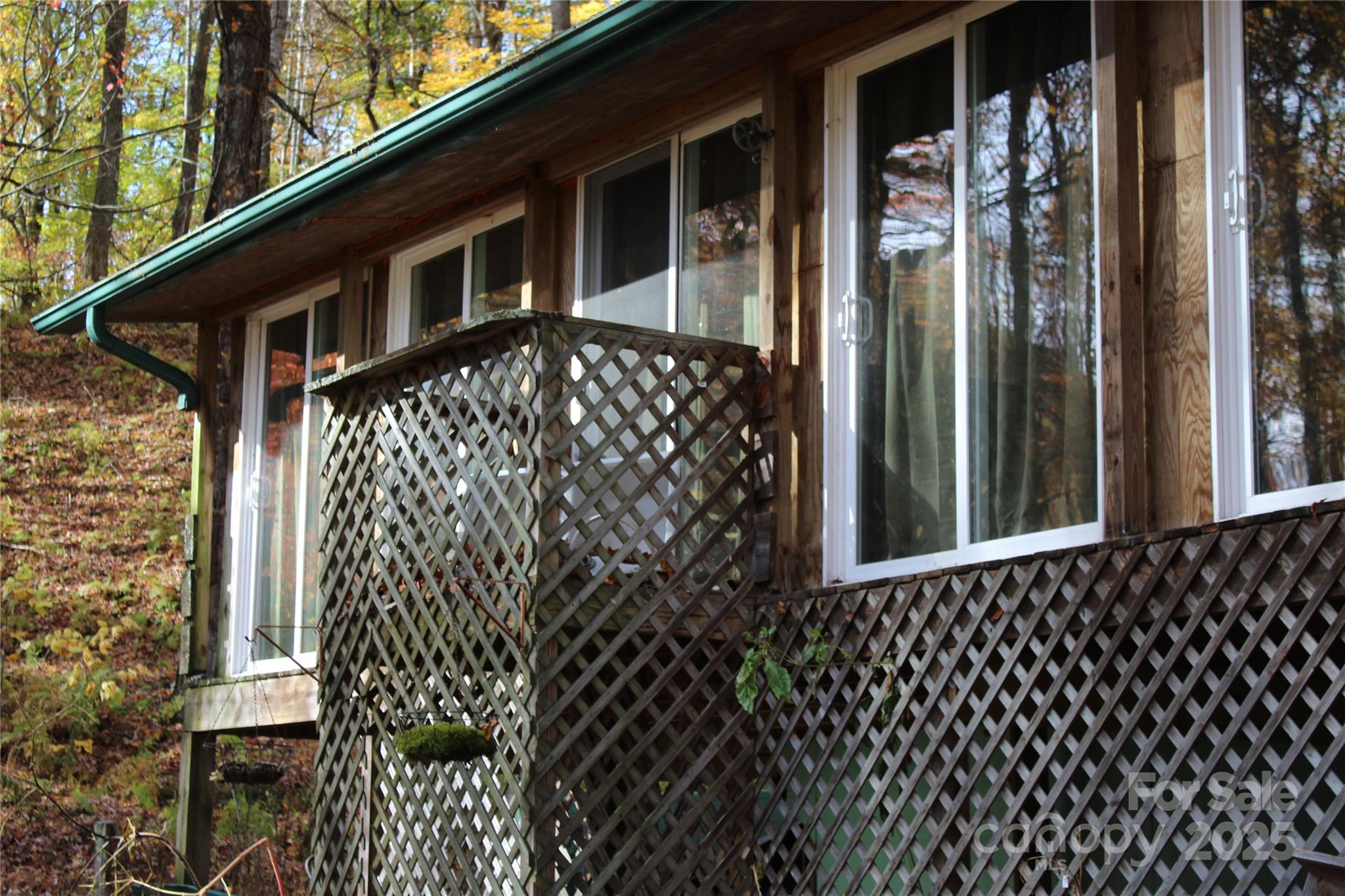 1571 Roaring Fork Road Burnsville, NC 28714 - Photo 33 of 37 a front view of a house with a yard
